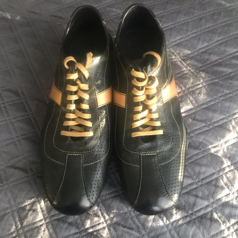 Cole Haan Black with Gold Trim Casual Sneaker.